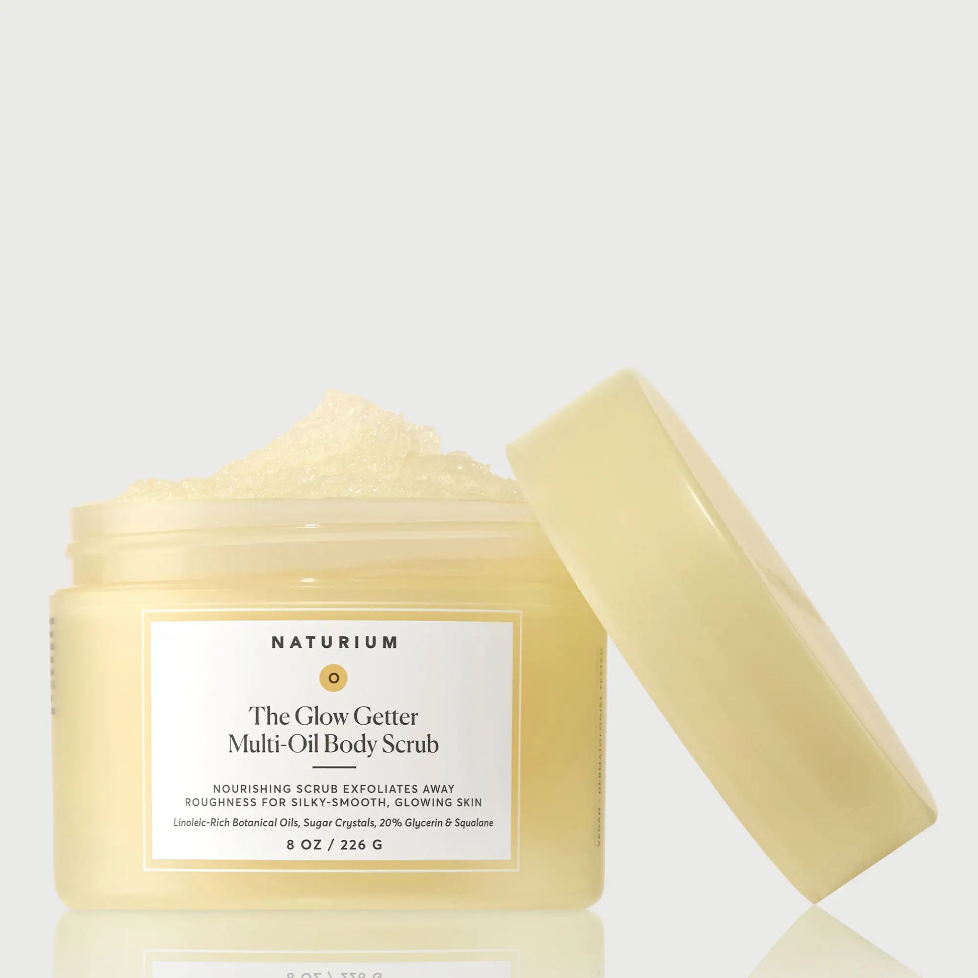 the-glow-getter-multi-oil-body-scrub-w2 NATR-40028-GlowGetter-Multi-Oil-Body-Scrub-Front-CapOff-bonebkgd.webp