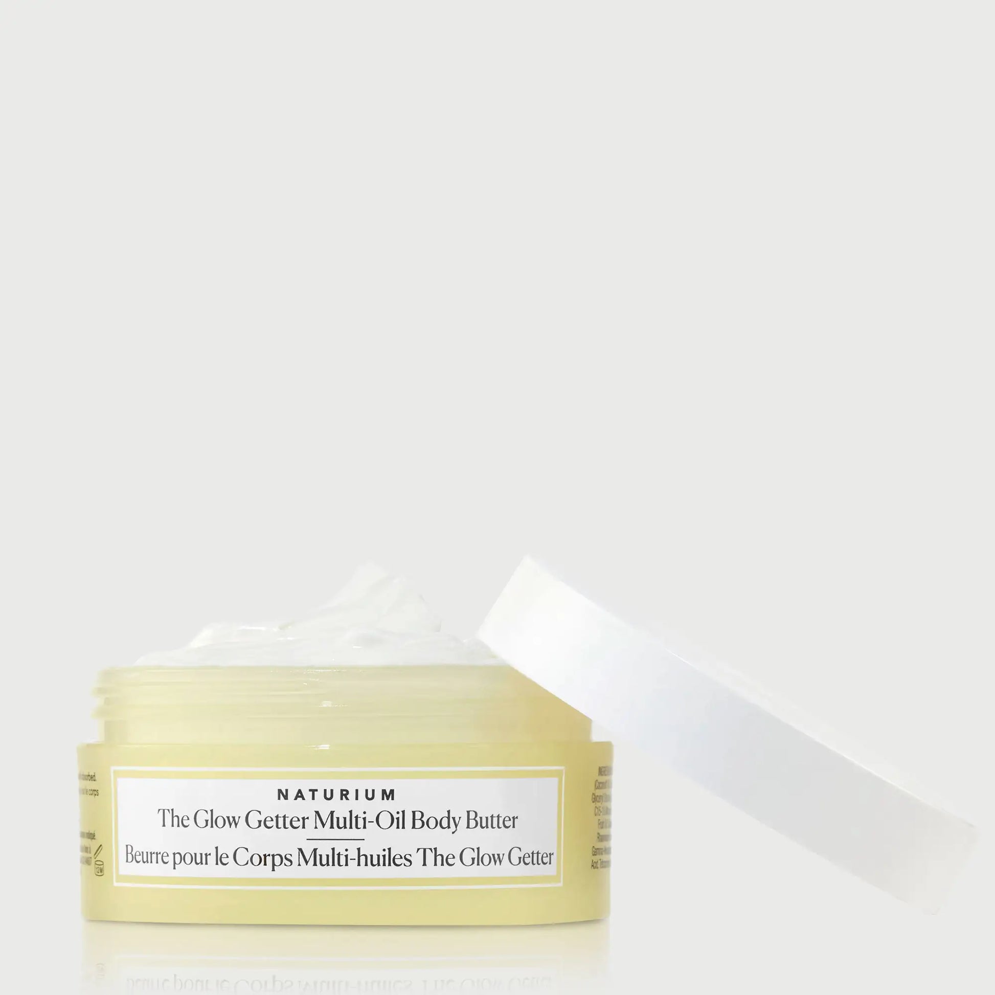 the-glow-getter-multi-oil-body-butter-travel-size-e7 NATR-40115_Glow-Getter-Body-Butter-Mini_front_capoff_bonebkgd.webp